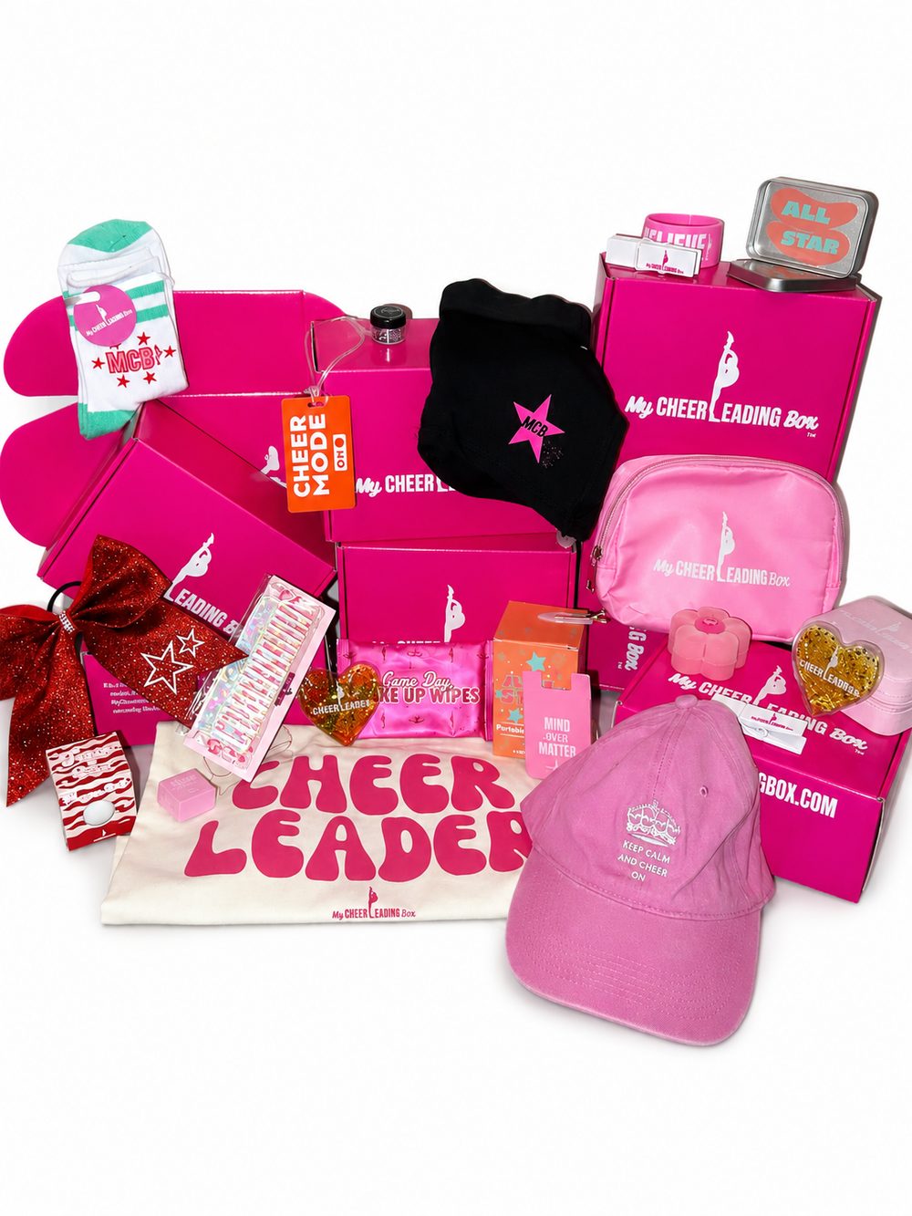 A full MyCheerleadingBox flat lay of apparel, bows, bags and accessories